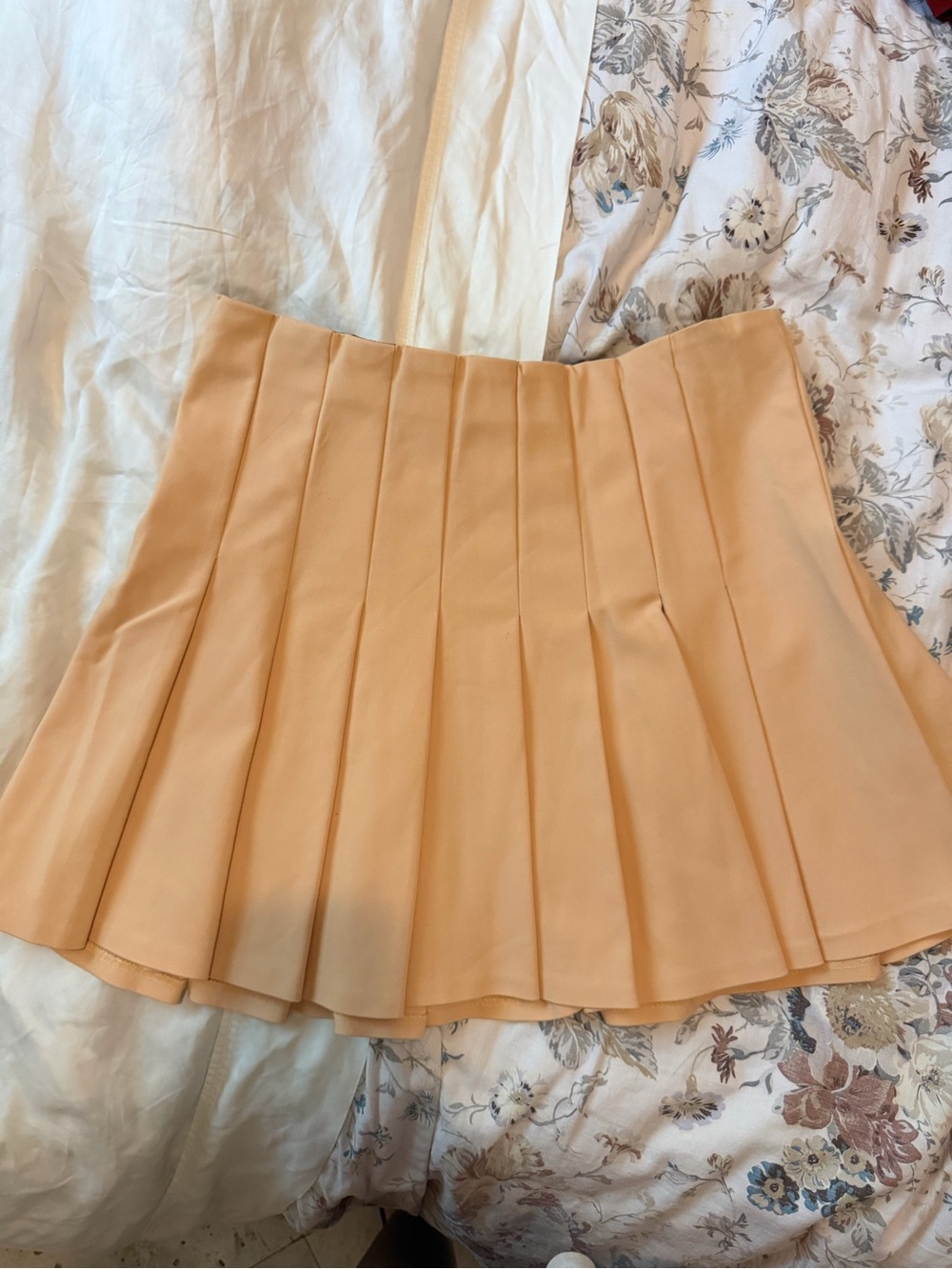 Pleated Mini Zara Skirt in a light Peach